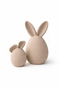 Set van twee moderne beige paashazen met eivormig design en hazenoren, minimalistische woondecoratie, pre-order product.